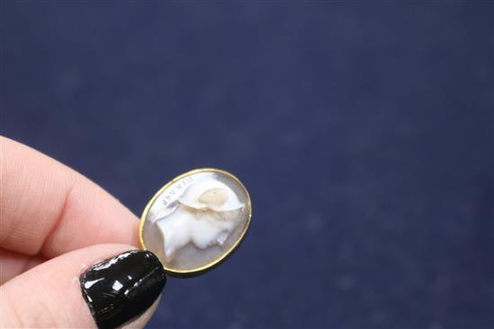 A 19th century yellow metal and sardonyx oval cameo stick pin, carved with the bust of Hermes to sinister, signed in Greek,